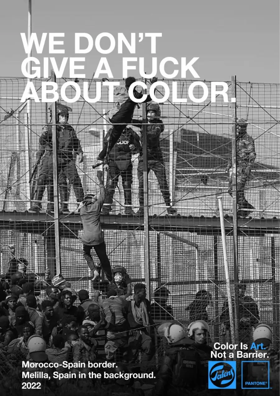 talens x pantone poster: 'we don't give a fuck about color' over a black and white photo of migrants climbing the morocco-spain border fence in melilla, framed like a pantone color chip